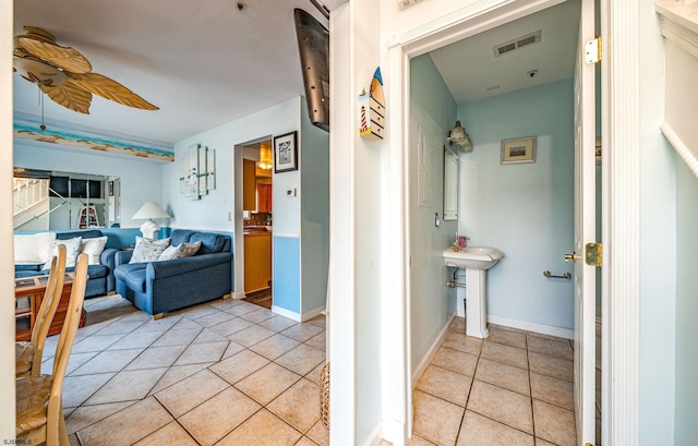 hallway with light tile patterned floors