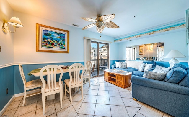 tiled living room featuring ceiling fan