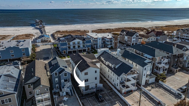 aerial view featuring a water view and a beach view