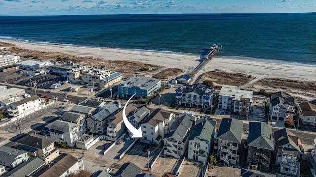 aerial view with a view of the beach and a water view