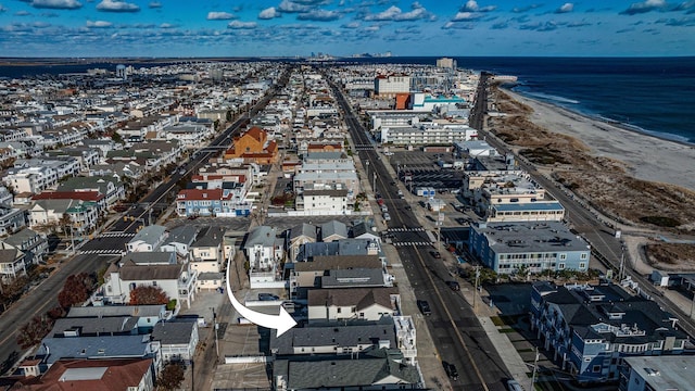 bird's eye view featuring a water view and a view of the beach