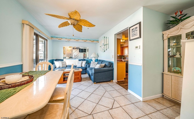 dining space featuring ceiling fan and light tile patterned flooring