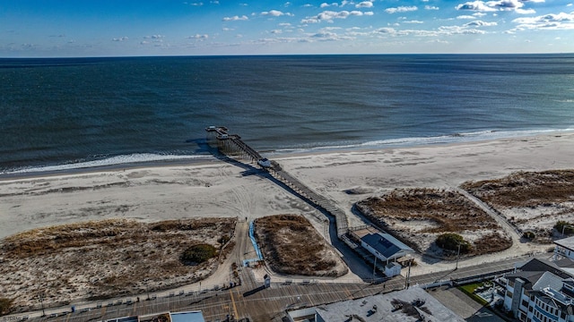 aerial view featuring a view of the beach and a water view