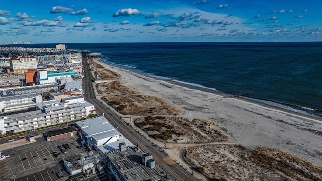 birds eye view of property featuring a water view and a view of the beach