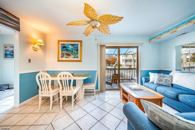 tiled living room with ceiling fan and a healthy amount of sunlight