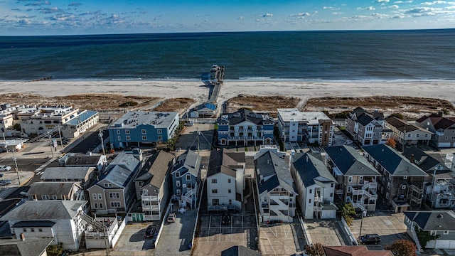 aerial view featuring a water view and a beach view