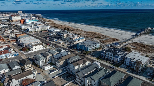 bird's eye view with a view of the beach and a water view