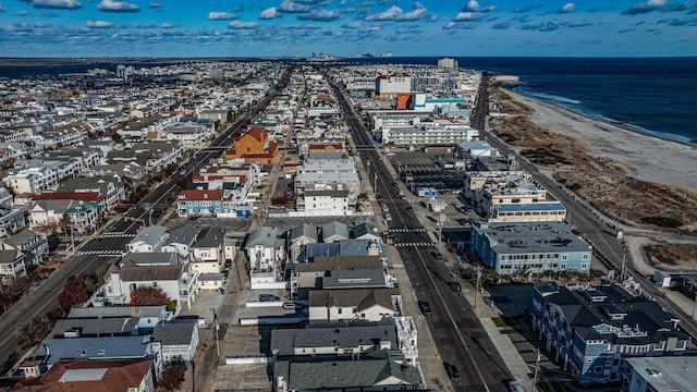 bird's eye view with a beach view and a water view