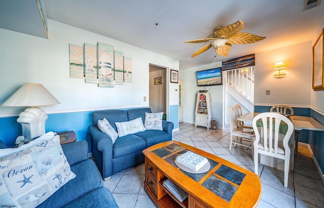 living room featuring ceiling fan and light tile patterned floors