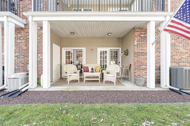 view of patio / terrace featuring central air condition unit and a balcony