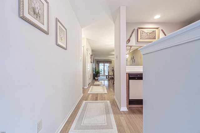 hallway featuring french doors and light hardwood / wood-style floors