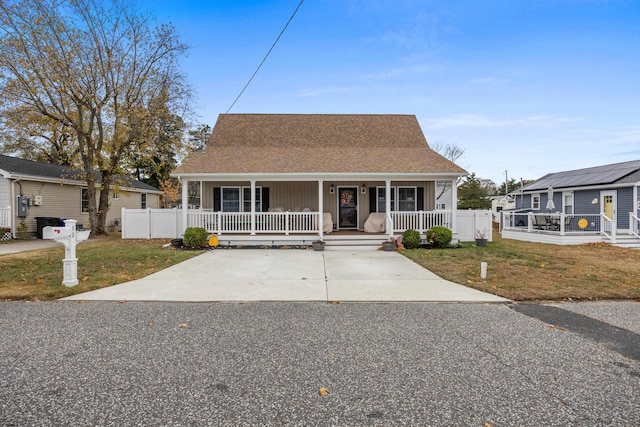 bungalow-style home with a porch and a front lawn