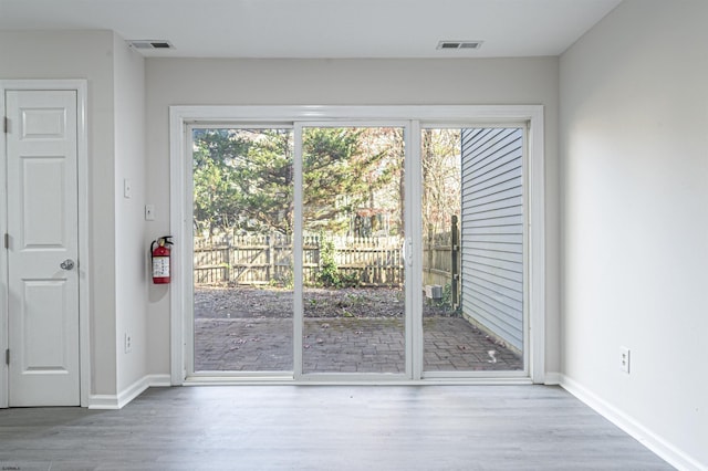 doorway with light hardwood / wood-style flooring