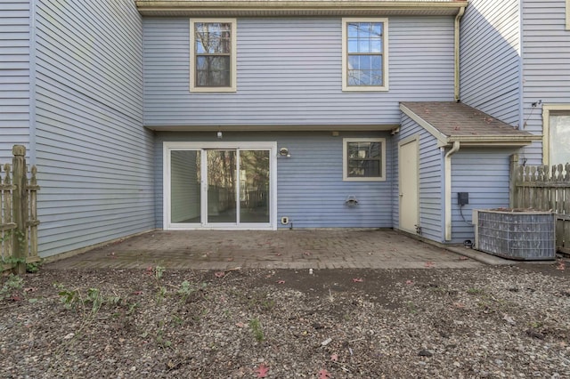 rear view of house featuring a patio area and central air condition unit