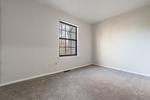 empty room with carpet flooring