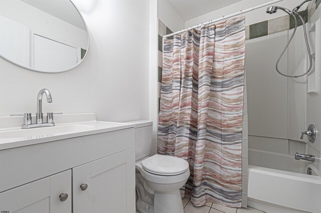 full bathroom with tile patterned floors, vanity, toilet, and shower / bath combo