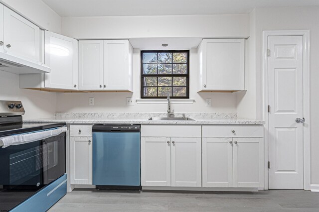 kitchen with sink, light hardwood / wood-style flooring, extractor fan, white cabinets, and appliances with stainless steel finishes