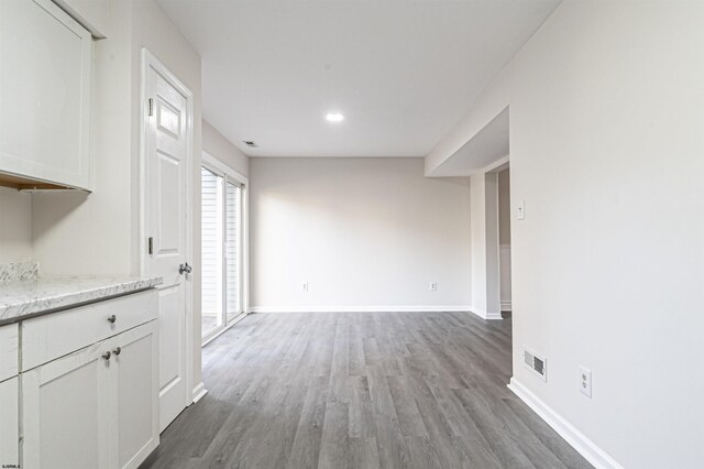 unfurnished dining area with wood-type flooring