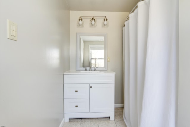 bathroom featuring tile patterned flooring and vanity