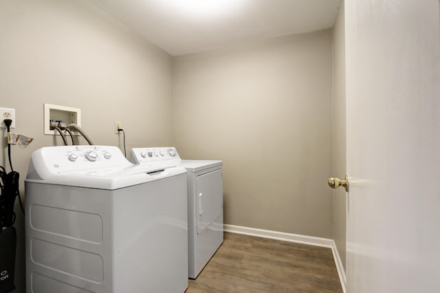 washroom featuring hardwood / wood-style floors and independent washer and dryer