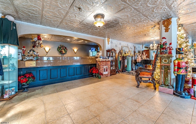 miscellaneous room with light tile patterned floors