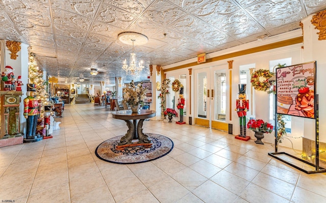 entrance foyer featuring light tile patterned floors and a chandelier