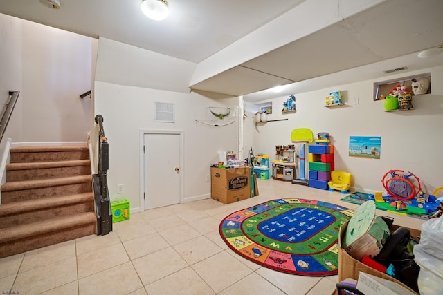 rec room featuring light tile patterned flooring