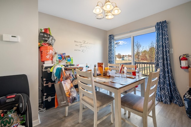 dining room featuring a chandelier and hardwood / wood-style floors