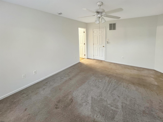 spare room with carpet flooring and ceiling fan