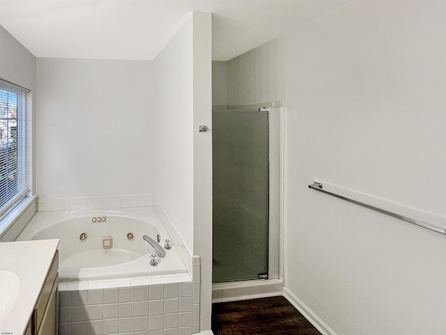 bathroom featuring vanity, wood-type flooring, and independent shower and bath