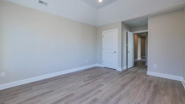 empty room with light hardwood / wood-style floors