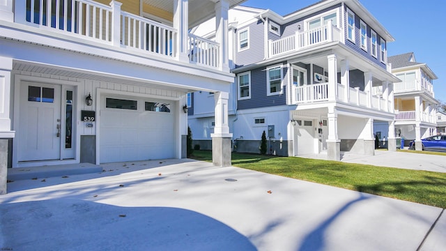 view of side of property with a balcony and a garage