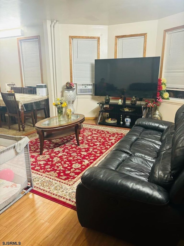 living room featuring hardwood / wood-style flooring and cooling unit