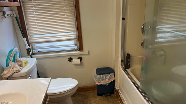 full bathroom featuring vanity, toilet, and bath / shower combo with glass door