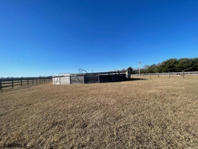 view of yard with a rural view