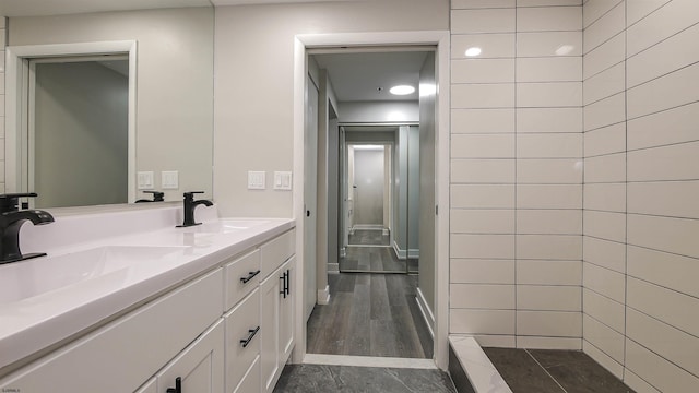 bathroom featuring vanity and hardwood / wood-style flooring