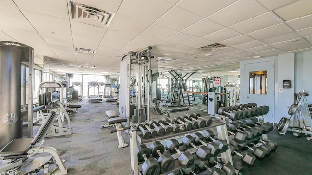 exercise room with a drop ceiling