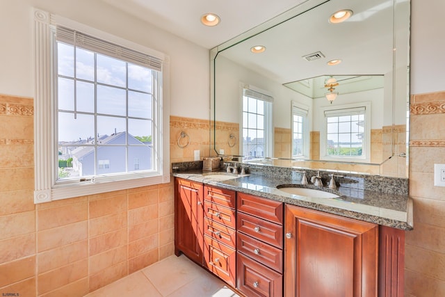 bathroom featuring tile patterned flooring and tile walls