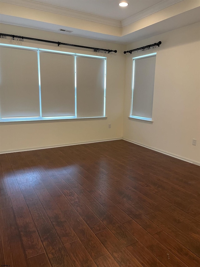 unfurnished room with dark hardwood / wood-style flooring and ornamental molding