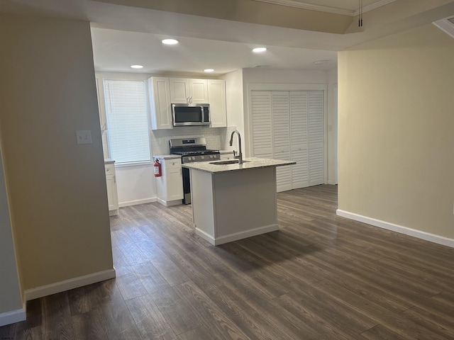 kitchen with dark hardwood / wood-style flooring, sink, white cabinets, and appliances with stainless steel finishes