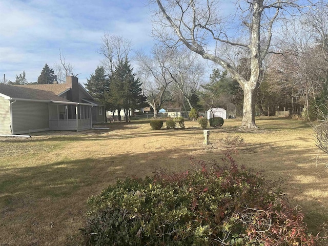 view of yard featuring a sunroom