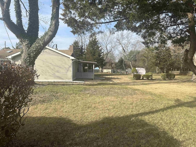 view of yard with a sunroom