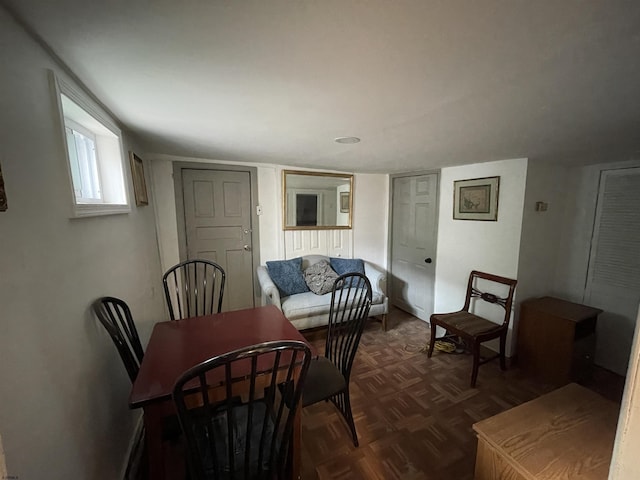 dining room featuring dark parquet floors