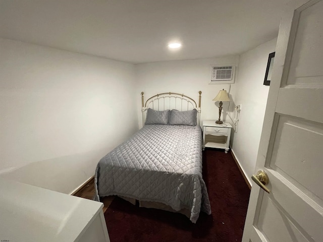 carpeted bedroom with a wall unit AC