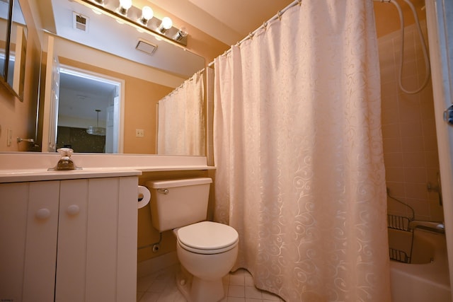 full bathroom with tile patterned flooring, vanity, toilet, and shower / bath combo with shower curtain