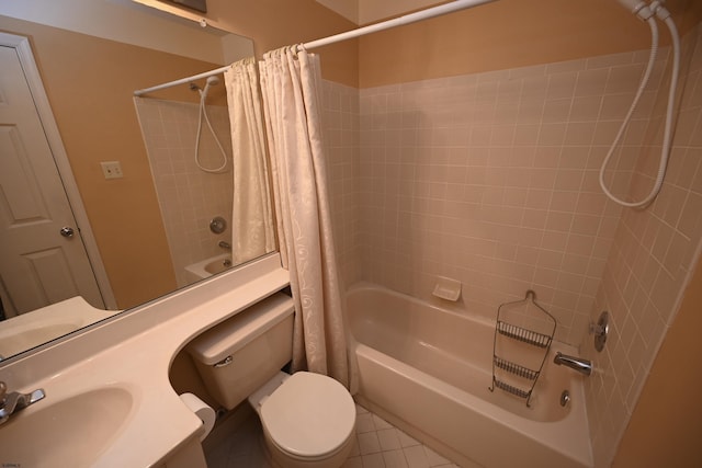 full bathroom with tile patterned flooring, toilet, shower / bath combo with shower curtain, and sink