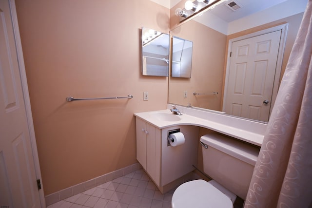 bathroom with tile patterned floors, vanity, and toilet