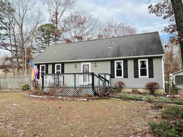 single story home featuring a wooden deck