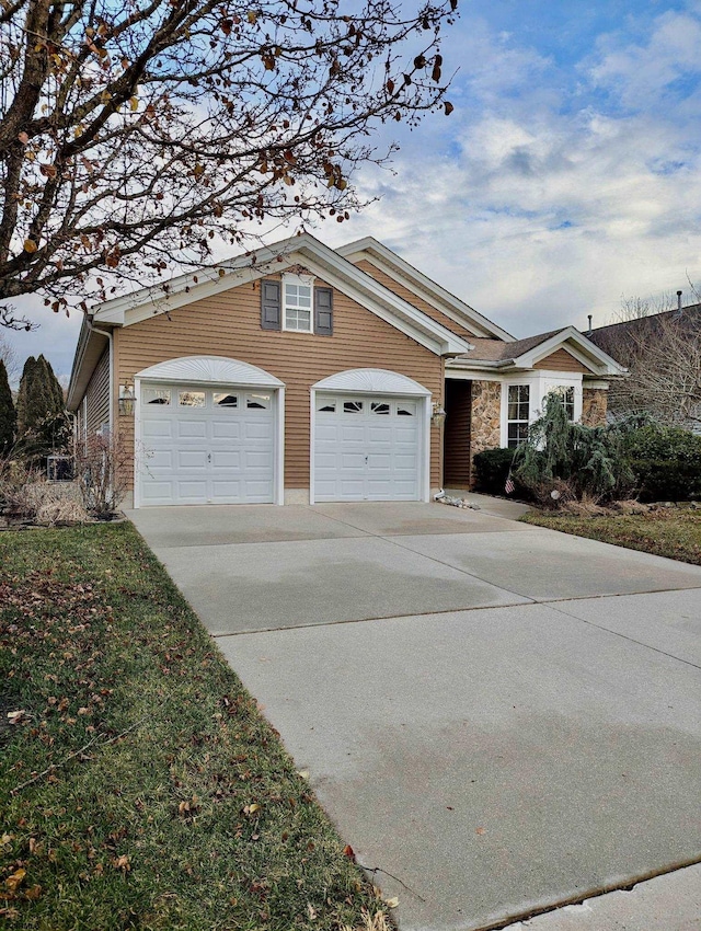 ranch-style home featuring a garage