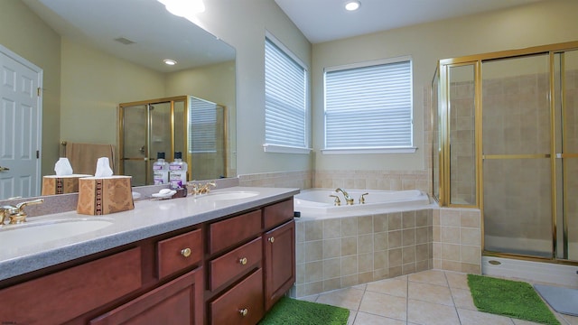 bathroom with tile patterned floors, vanity, and independent shower and bath